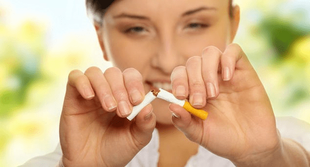 girl breaks a cigarette and gets rid of addiction